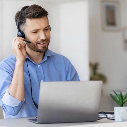 hotline operator portrait of call center employee wearing headset at workplace in office transformed